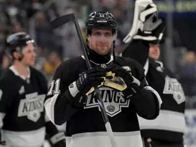 Apr 23, 2025; Los Angeles, California, USA; Los Angeles Kings center Anze Kopitar (11) makes a heart with his gloves for he daughter after defeating the Edmonton Oilers in game 2 of the 2025 Stanley Cup Playoffs at Crypto.com Arena. Mandatory Credit: Jayne Kamin-Oncea-Imagn Images