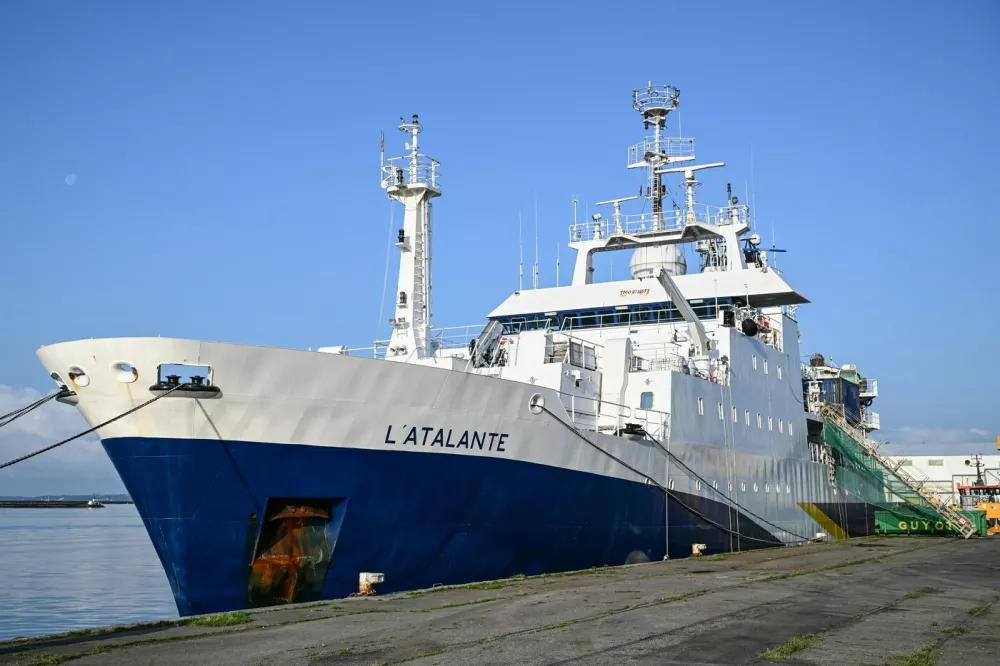 This photograph shows the scientific ship L'Atalante docked at the port of Brest before its departure, in Brest, western France, on June 15, 2025. Between 1950 and 1990, more than 200,000 barrels filled with radioactive waste were thrown into the abyss of the Northeast Atlantic Ocean. The first mission of the NODSSUM campaign, planned from June 15 to July 11, 2025 and led by the French National Centre for Scientific Research (CNRS), aims to map the main barrel immersion area and study interactions with marine biodiversity.,Image: 1011220252, License: Rights-managed, Restrictions:, Model Release: no