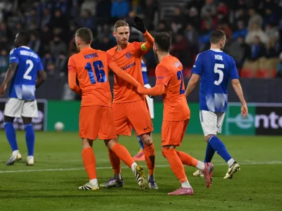 27 November 2025, Czech Republic, Olomouc: Celje players celebrate after scoring their side's first goal of the game during the UEFA Europa Conference League soccer match between SK Sigma Olomouc and NK Celje at Andruv stadium. Photo: Peřina Luděk/CTK/dpa