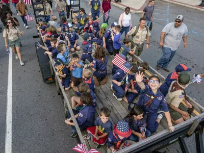 Scouting America participants from Anderson wave on a trailer during The Anderson County Veterans Parade held Sunday, November 9, in downtown Anderson, S.C.