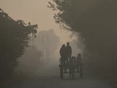 Indian ride horse cart on a cold and foggy morning near the India-Pakistan international border area of Ranbir Singh Pura, about 35 kilometers (22 miles) south of Jammu, India, Monday, Nov. 24, 2025.(AP Photo/Channi Anand)
