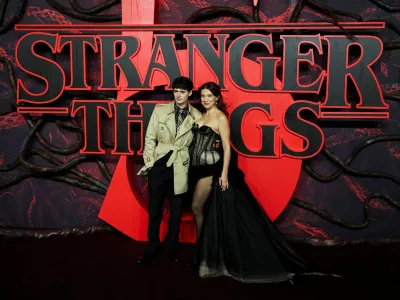 FILE PHOTO: Cast members Noah Schnapp and Millie Bobby Brown attend the screening for the final season of the television series "Stranger Things", at Odeon Luxe Leicester Square in London, Britain, November 13, 2025. REUTERS/Isabel Infantes/File Photo