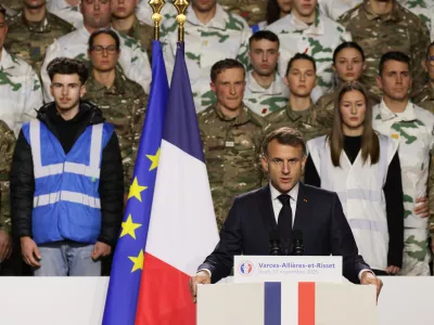 France's President Emmanuel Macron, unveils a new national military service as he speaks to the army at the military base in Varces, French Alps, Thursday, Nov. 27, 2025.(AP Photo/Thomas Padilla, Pool)