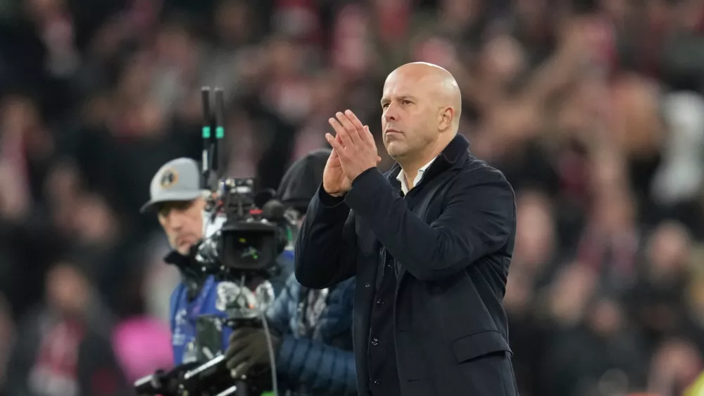 Liverpool's manager Arne Slot applauds after the Champions League opening phase soccer match between Liverpool and PSV in Liverpool, England, Wednesday, Nov. 26, 2025. (AP Photo/Jon Super)