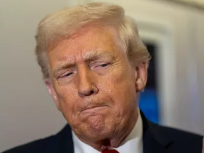 President Donald Trump pauses while speaking with reporters while in flight on Air Force One from Joint Base Andrews to his Mar-a-Lago estate in Palm Beach, Fla., Tuesday, Nov. 25, 2025. (AP Photo/Alex Brandon)