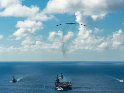 FILE PHOTO: The U.S. Navy's Gerald R. Ford Carrier Strike Group, including the flagship USS Gerald R. Ford, USS Winston S. Churchill, USS Mahan and USS Bainbridge, sail towards the Caribbean Sea under F/A-18E/F Super Hornets and a U.S. Air Force B-52 Stratofortress, in the Atlantic Ocean November 13, 2025. U.S. Navy/Petty Officer 3rd Class Gladjimi Balisage/Handout via REUTERS. THIS IMAGE HAS BEEN SUPPLIED BY A THIRD PARTY/File Photo
