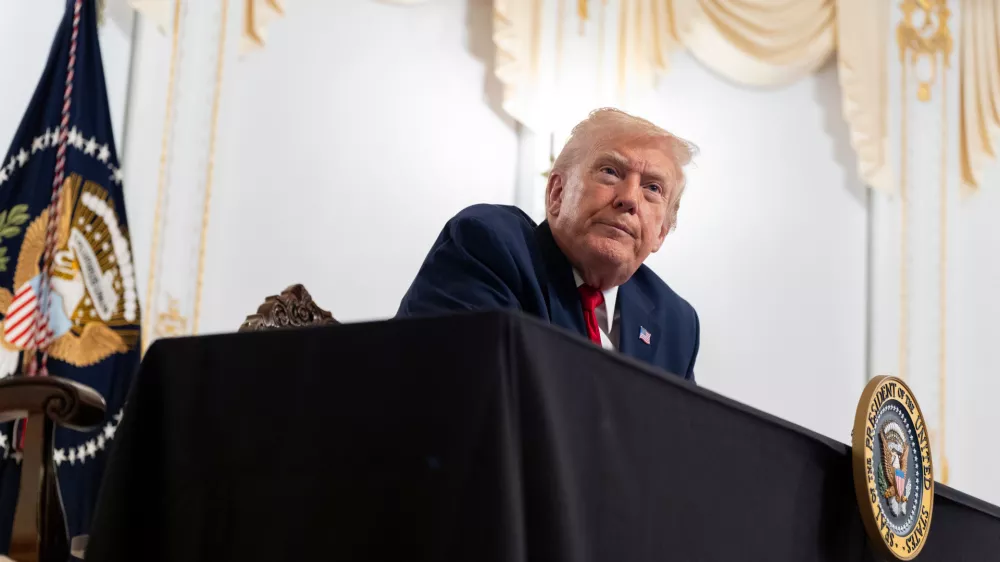 President Donald Trump speaks to reporters after speaking to troops via video from his Mar-a-Lago estate on Thanksgiving, Thursday, Nov. 27, 2025, in Palm Beach, Fla. (AP Photo/Alex Brandon)