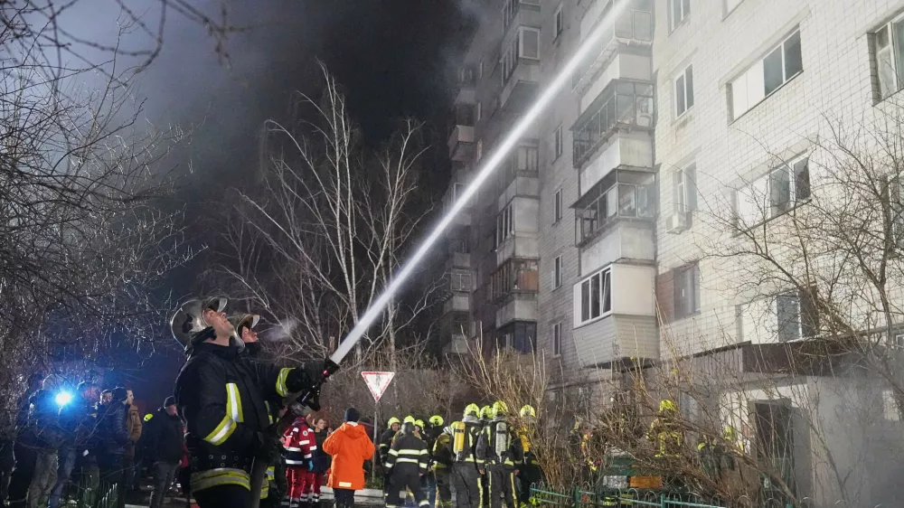 Firefighters put out a blaze after a Russian attack in Vyshgorod, outside of Kyiv, Ukraine, early Sunday, Nov. 30, 2025. (AP Photo/Efrem Lukatsky)