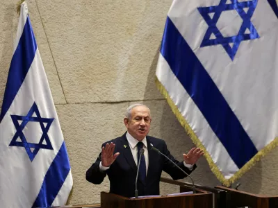 FILE PHOTO: Israeli Prime Minister Benjamin Netanyahu speaks at the plenum of the Knesset, Israel's parliament, in Jerusalem, November 10, 2025. REUTERS/Ronen Zvulun/File Photo