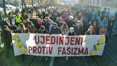 People carry a banner reading: "United against fascism" during a protest against what they say is the rising use of far-right symbols and rhetoric, in Zagreb, Croatia, November 30, 2025. REUTERS/Antonio Bronic