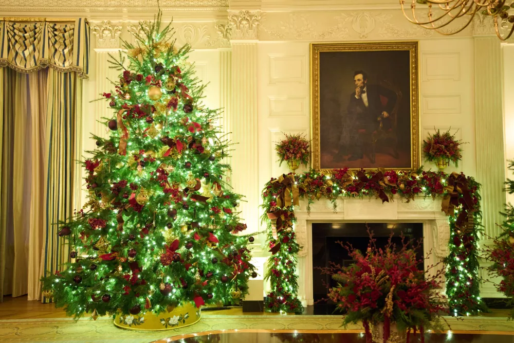 Christmas trees decorate the State Dining Room of the White House during a press preview of the Christmas decorations "Home is Where the Heart Is," Monday, Dec. 1, 2025, in Washington. (AP Photo/Evan Vucci)