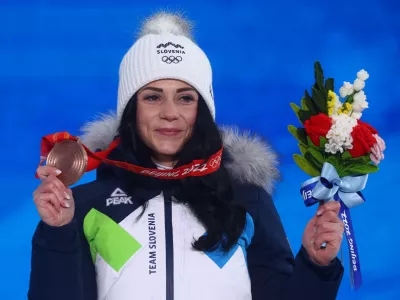﻿2022 Beijing Olympics - Victory Ceremony - Snowboard - Women's Parallel Giant Slalom - Zhangjiakou Medals Plaza, Zhangjiakou, China - February 8, 2022. Bronze medallist Gloria Kotnik of Slovenia poses with her medal during the victory ceremony. REUTERS/Kai Pfaffenbach
