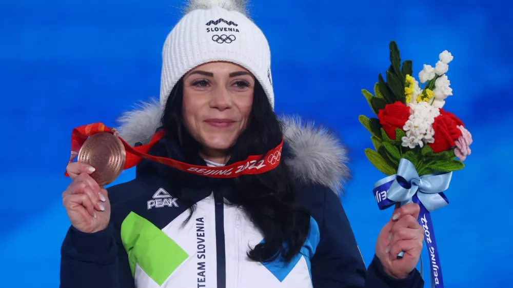 ﻿2022 Beijing Olympics - Victory Ceremony - Snowboard - Women's Parallel Giant Slalom - Zhangjiakou Medals Plaza, Zhangjiakou, China - February 8, 2022. Bronze medallist Gloria Kotnik of Slovenia poses with her medal during the victory ceremony. REUTERS/Kai Pfaffenbach