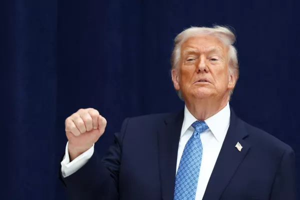 U.S. President Donald Trump gestures during a signing ceremony with President of the Democratic Republic of the Congo Felix Tshisekedi and President of Rwanda Paul Kagame at the U.S. Institute of Peace in Washington, D.C., U.S., December 4, 2025. REUTERS/Kevin Lamarque
