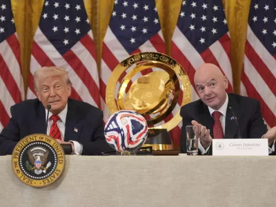 President Donald Trump listens as FIFA President Gianni Infantino speaks during a FIFA task force meeting on the 2026 FIFA World Cup in the East Room of the White House, Tuesday, May 6, 2025, in Washington. (AP Photo/Mark Schiefelbein)