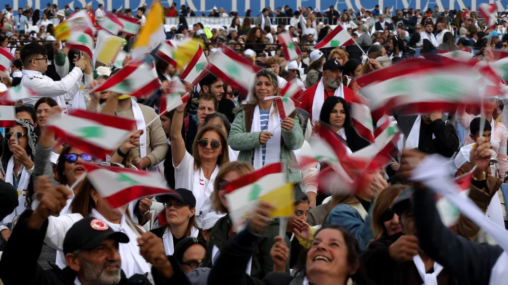 02 December 2025, Lebanon, Beirut: Lebanese believers attend a mass prayer conducted by Pope Leo XIV in Beirut at the end of his visit to Lebanon. Photo: Marwan Naamani/dpa