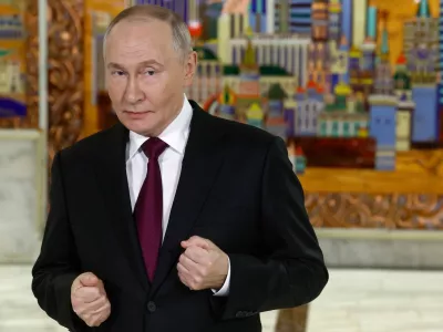 Russian President Vladimir Putin gestures while speaking to journalists after the plenary session of the VTB "Russia Calling" Investment forum in Moscow, Tuesday, Dec. 2, 2025. (Sergei Ilnitsky/Pool Photo via AP)