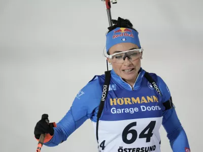 Dorothea Wierer, Italy, crosses the finish line of the Biathlon women's World Cup 15 km event, in Östersund, Sweden, Tuesday, Dec. 2, 2025. (Björn Larsson Rosvall/TT News Agency via AP)