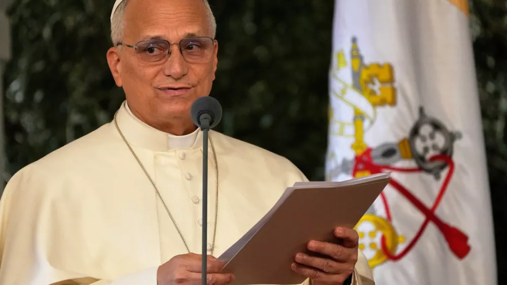 Pope Leo XIV reads a speech during a farewell ceremony at the Beirut International Airport in Beirut, Lebanon, Tuesday, Dec. 2, 12025.(AP Photo/Hussein Malla)