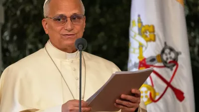 Pope Leo XIV reads a speech during a farewell ceremony at the Beirut International Airport in Beirut, Lebanon, Tuesday, Dec. 2, 12025.(AP Photo/Hussein Malla)
