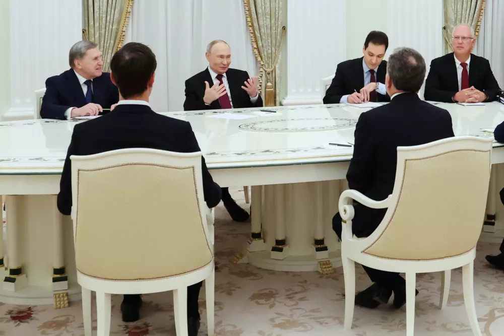 Russian President Vladimir Putin, second left, Russian Presidential foreign policy adviser Yuri Ushakov, left, and Russian Direct Investment Fund CEO Special Presidential Representative for Investment and Economic Cooperation with Foreign Countries Kirill Dmitriev, right, attend talks with U.S. special envoy Steve Witkoff, right back to a camera, and Jared Kushner, U.S. President Donald Trump's son-in-law, left back to a camera, at the Senate Palace of the Kremlin in Moscow, Russia, Tuesday, Dec. 2, 2025. (Alexander Kazakov, Sputnik, Kremlin Pool Photo via AP)