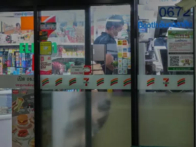 A Thai customer lines up to pay money at a convenience store in Bangkok, Thailand, Wednesday, Dec. 3, 2025. (AP Photo/Sakchai Lalit)