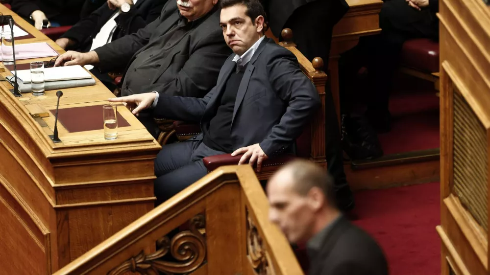 ﻿Greek Prime Minister Alexis Tsipras (C) listens to the speech of Greek Finance Minister Yanis Varoufakis (bottom) before a vote of confidence at the parliament in Athens February 10, 2015. Athens is not seeking a clash with its European partners but cannot exclude one, Varoufakis told parliament on the eve of a crucial euro zone finance ministers' meeting to discuss the country's future. REUTERS/Alkis Konstantinidis (GREECE - Tags: POLITICS BUSINESS)