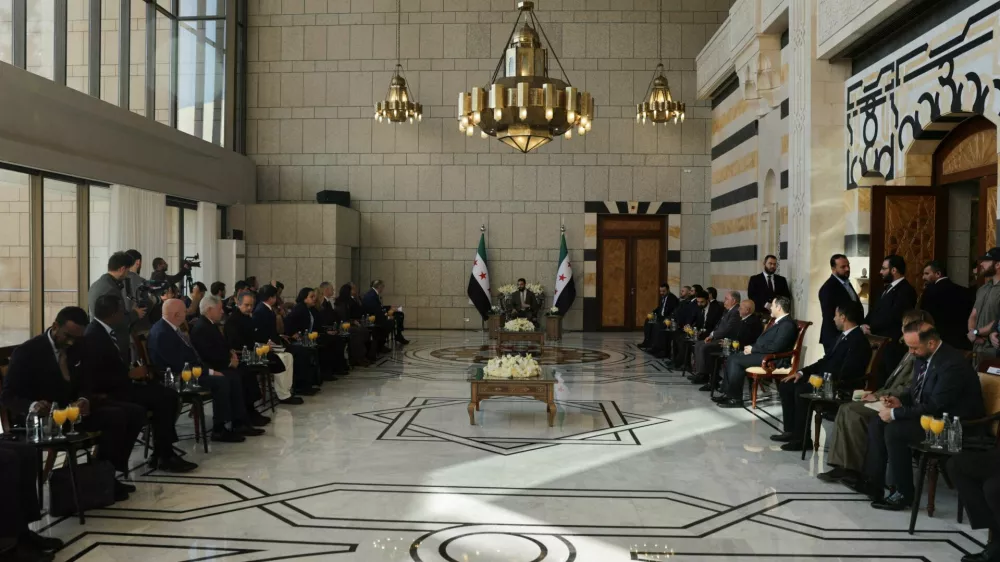 Syria's President Ahmed al-Sharaa meets representatives of the 15 members of the United Nations Security Council at the People's Palace in Damascus, Syria, December 4, 2025. REUTERS/Khalil Ashawi