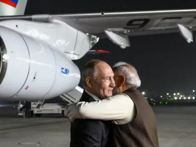 Russian President Vladimir Putin, left, and Indian Prime Minister Narendra Modi embrace each other at the Palam Air Base in New Delhi, India, on Thursday, Dec. 4, 2025. (Grigory Sysoyev, Sputnik, Kremlin Pool Photo via AP)