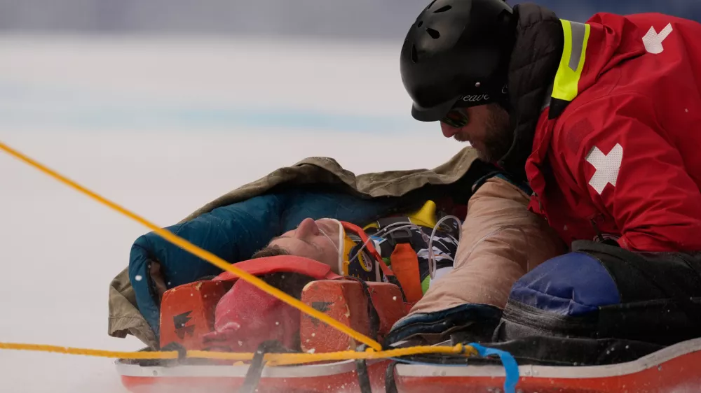 Slovenia's Rok Elezi Aznoh is brought down on a sled after a crash while competing during a World Cup men's downhill skiing race, Thursday, Dec. 4, 2025, in Beaver Creek, Colo. (AP Photo/Robert F. Bukaty)
