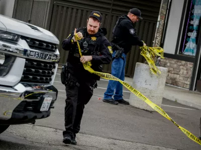 Investigators with the San Joaquin Sheriff's Department remove crime scene tape at Thornton Blvd. and Lucile Ave., where a mass shooting took place Saturday in a banquet hall in Stockton, Calif., Sunday, Nov. 30, 2025. (Brontë Wittpenn/San Francisco Chronicle via AP)