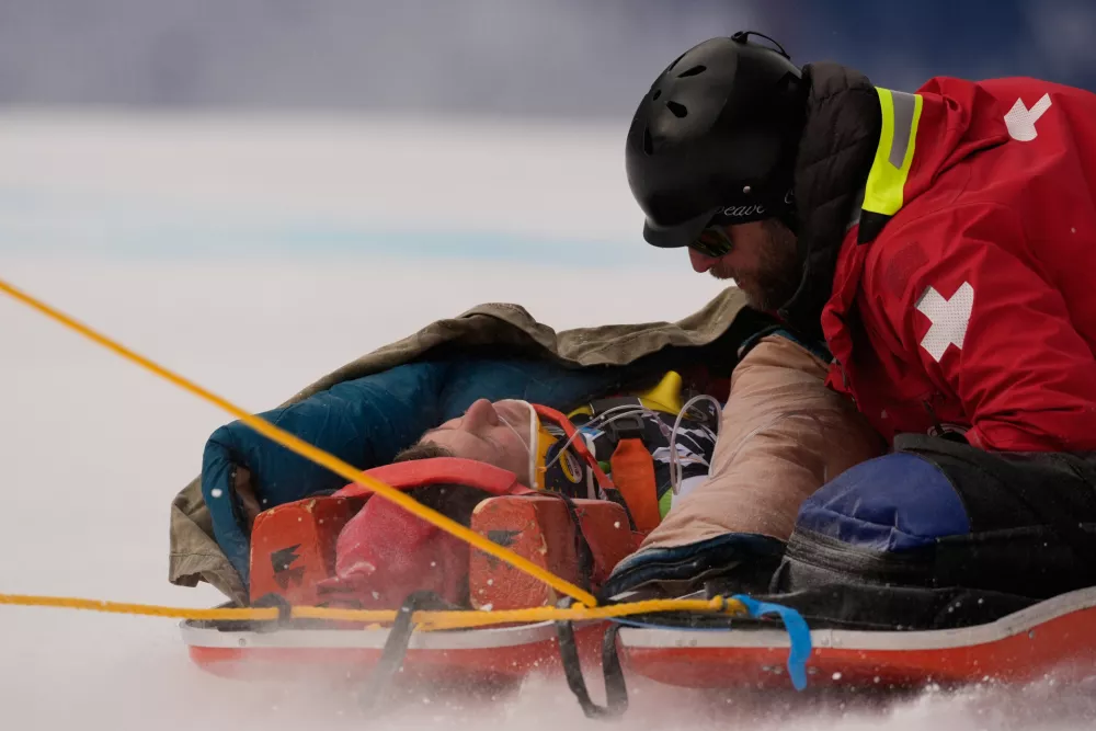Slovenia's Rok Elezi Aznoh is brought down on a sled after a crash while competing during a World Cup men's downhill skiing race, Thursday, Dec. 4, 2025, in Beaver Creek, Colo. (AP Photo/Robert F. Bukaty)