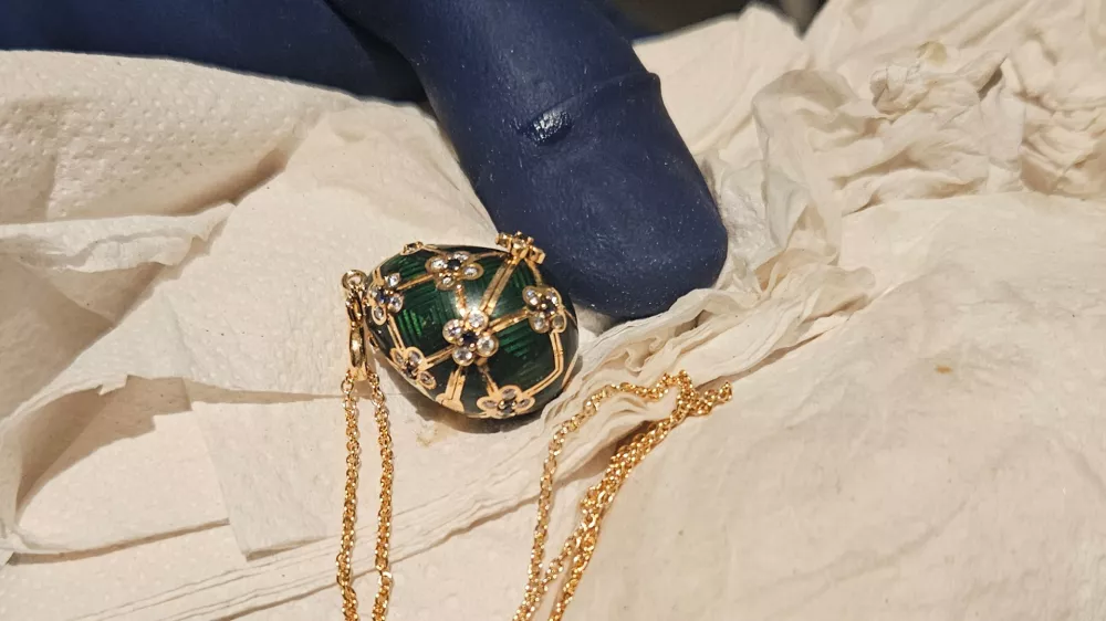 In this photo provided by the New Zealand Police a Fabergé pendant is held after it was recovered, Thursday, Dec. 4, 2025, from a man accused of stealing and swallowing the pendant. (New Zealand Police via AP)