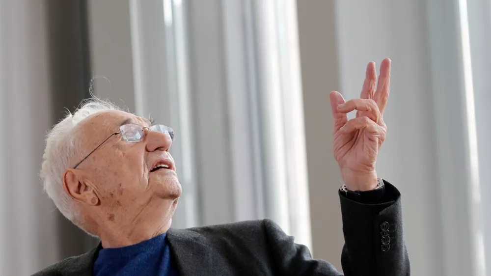 FILE - American architect Frank Gehry speaks to journalists during the press day of his latest creation, the Louis Vuitton Foundation art museum and cultural center, in Paris, Oct. 17, 2014. (AP Photo/Christophe Ena, File)