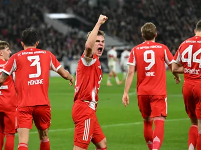 Soccer Football - Bundesliga - VfB Stuttgart v Bayern Munich - MHPArena, Stuttgart, Germany - December 6, 2025 Bayern Munich's Joshua Kimmich celebrates after Harry Kane scored their fourth goal REUTERS/Angelika Warmuth DFL REGULATIONS PROHIBIT ANY USE OF PHOTOGRAPHS AS IMAGE SEQUENCES AND/OR QUASI-VIDEO.
