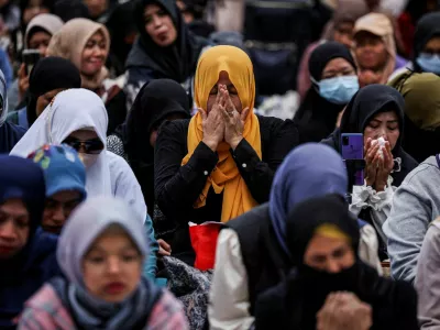 Mourners attend a Muslim prayer gathering, organized by the Indonesian community, for victims of the deadly fire that occurred on Wednesday at the Wang Fuk Court housing complex in Tai Po, in Hong Kong, China, November 30, 2025. REUTERS/Amr Alfiky   TPX IMAGES OF THE DAY        SEARCH "HONG KONG LOSS" FOR THIS STORY. SEARCH "WIDER IMAGE" FOR ALL STORIES.
