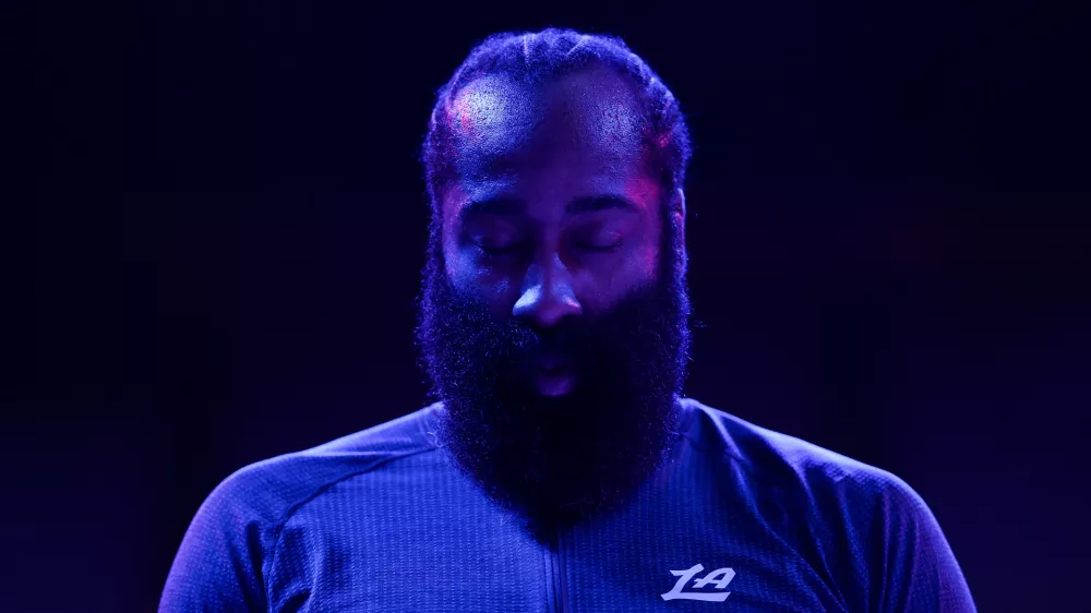 Los Angeles Clippers guard James Harden (1) stands during the national anthem before an NBA basketball game against the Minnesota Timberwolves Saturday, Dec. 6, 2025, in Minneapolis. (AP Photo/Matt Krohn)