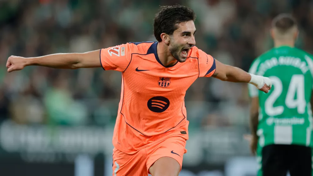 Barcelona's Ferran Torres celebrates after scoring his side second goal during the Spanish La Liga soccer match between Real Betis and Barcelona in Seville, Spain, Saturday, Dec. 6, 2025. (AP Phot/Manu Reino)