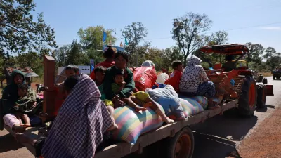 People flee amid clashes between Thailand and Cambodia along a disputed border area, in Oddar Meanchey Province, Cambodia, December 8, 2025. Agence Kampuchea Press/Handout via REUTERS  THIS IMAGE HAS BEEN SUPPLIED BY A THIRD PARTY. NO RESALES. NO ARCHIVES.