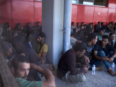 FILE - Migrants rescued south of Crete wait to be registered on their arrival at the the port of Lavrio, Greece, on Thursday, July 10, 2025. (AP Photo/Petros Giannakouris, file)