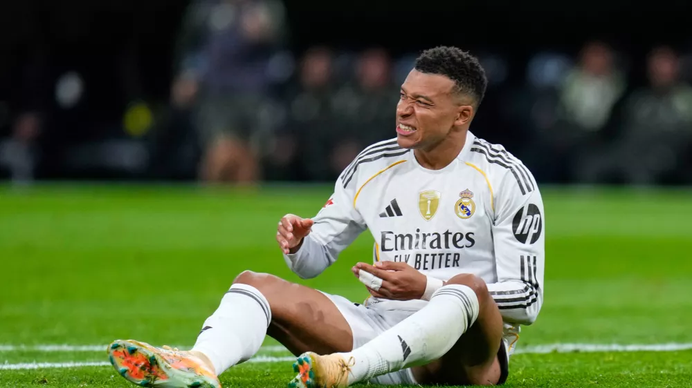 Real Madrid's Kylian Mbappe reacts during the Spanish La Liga soccer match between Real Madrid and Celta Vigo in Madrid, Spain, Sunday, Dec. 7, 2025. (AP Photo/Manu Fernandez)