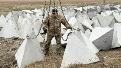 A Ukrainian serviceman installs anti-tank fortifications, named 'dragon's teeth', amid Russia's attack on Ukraine, in Donetsk region, Ukraine December 8, 2025. REUTERS/Stringer