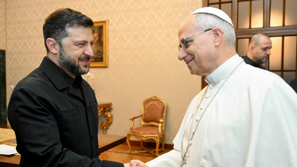 Pope Leo XIV and Ukraine's President Volodymyr Zelenskiy shake hands at Villa Barberini in Castel Gandolfo, Italy, December 9, 2025.  Vatican Media/­Simone Risoluti/Handout via REUTERS  ATTENTION EDITORS - THIS IMAGE WAS PROVIDED BY A THIRD PARTY.   TPX IMAGES OF THE DAY