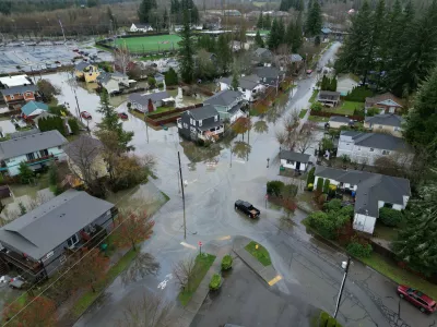 Some residential streets in downtown Snoqualmie, Wash., have standing water, Thursday morning, Dec. 11, 2025, as the downtown braces for a third crest of the Snoqualmie River later. (Ken Lambert/The Seattle Times via AP)