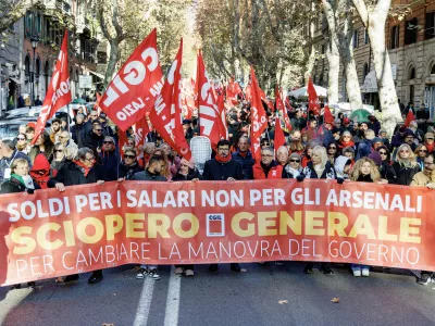 12 December 2025, Italy, Rome: People join a rally organized by CGIL on the occasion of the general strike against the budget law. Photo: Roberto Monaldo/LaPresse via ZUMA Press/dpa