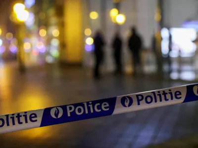 Police barricade tape is seen, as Belgian police keep guard outside the area where, according to police, a shooting took place, injuring several police officers, in Brussels, Belgium, December 6, 2023. REUTERS/Johanna Geron
