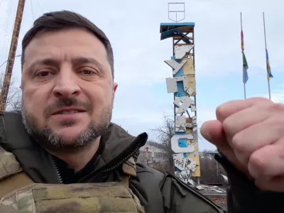 In this grab from a video provided by the Press Service Of The President Of Ukraine on Friday, Dec 12, 2025, Ukraine's President Volodymyr Zelenskyy records a video at the road entering of Kupiansk, Ukraine. (Press Service Of The President Of Ukraine via AP)