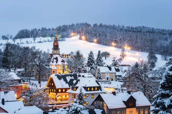 Illuminated houses in Seiffen at Christmastime. Saxony, Germany