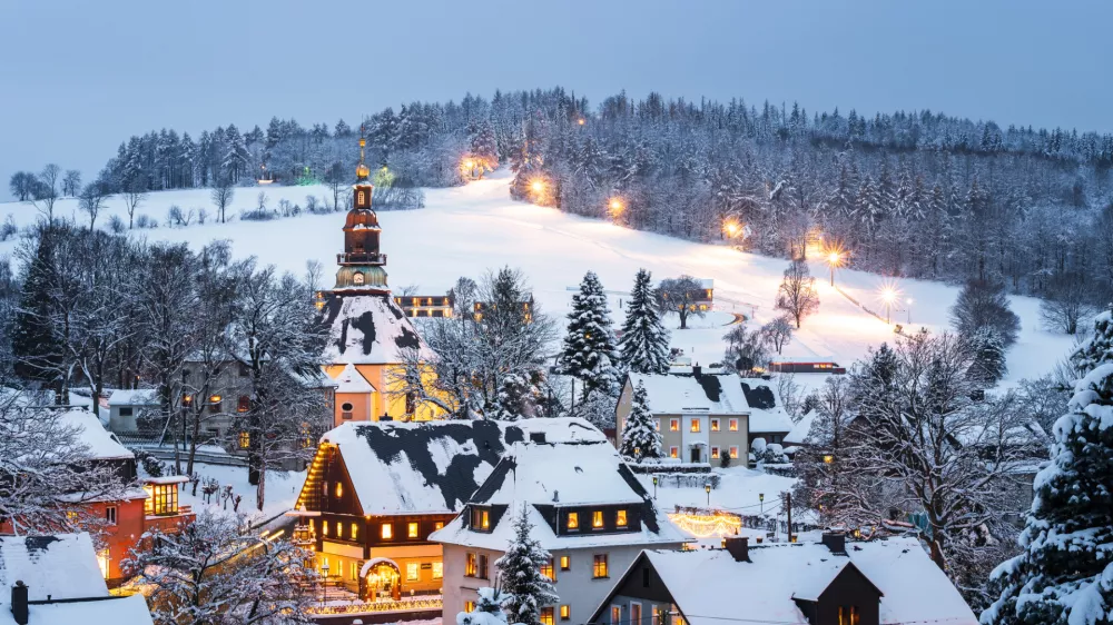 Illuminated houses in Seiffen at Christmastime. Saxony, Germany