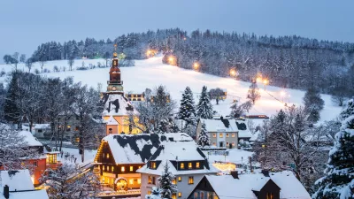 Illuminated houses in Seiffen at Christmastime. Saxony, Germany